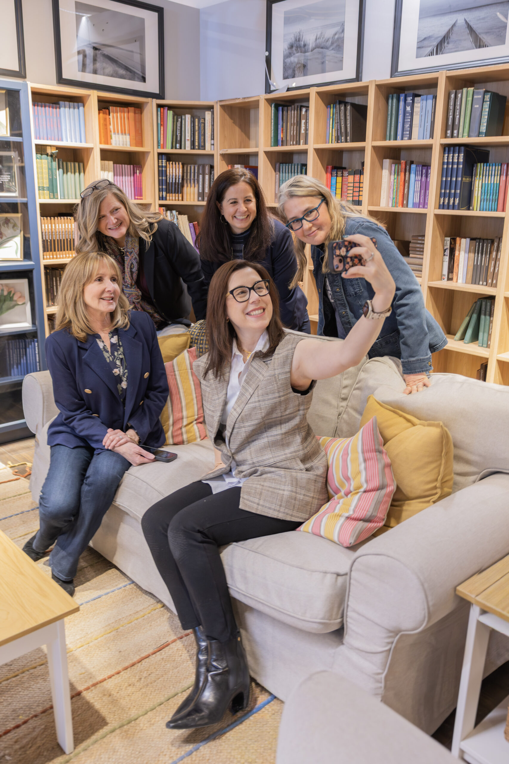 Women executive leadership team collaborating in a modern office environment